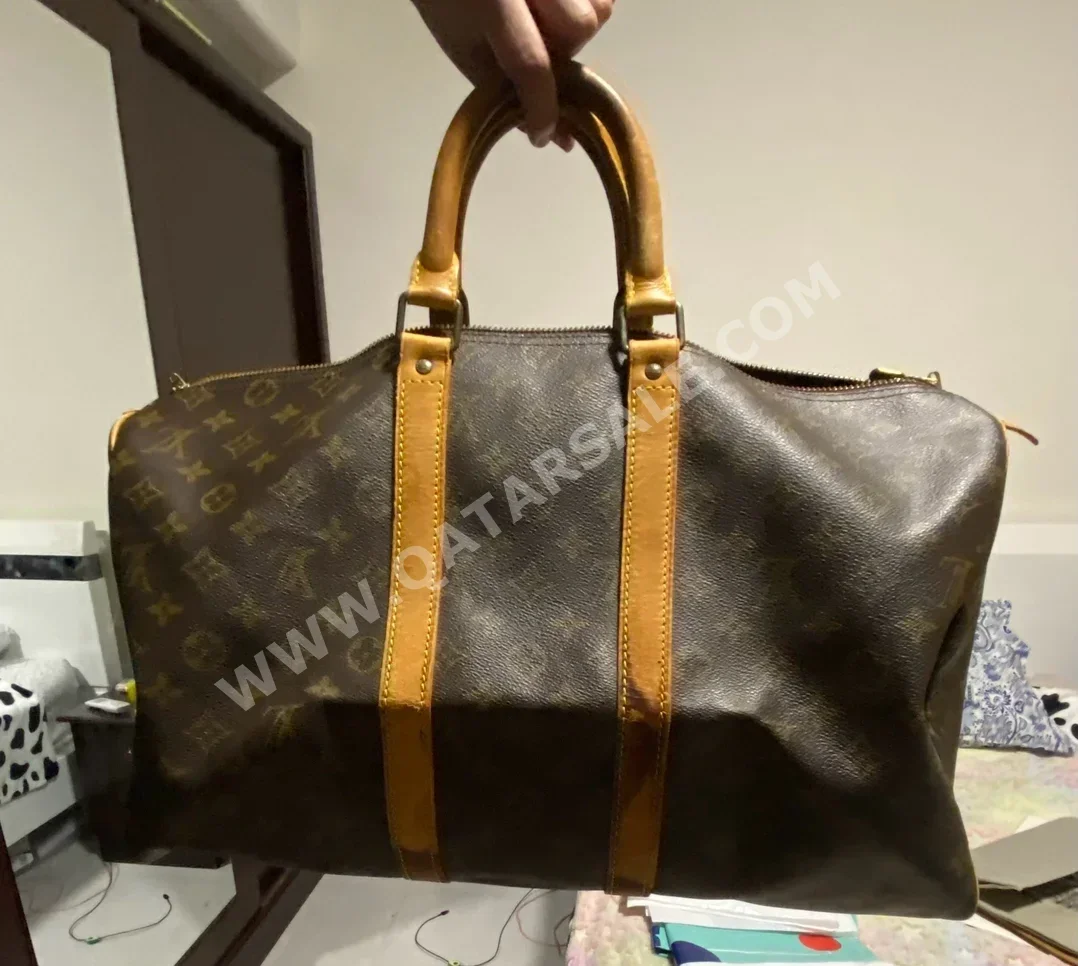 Travel Bags  - Louis Vuitton  - Brown  - Genuine Leather  - Unisex