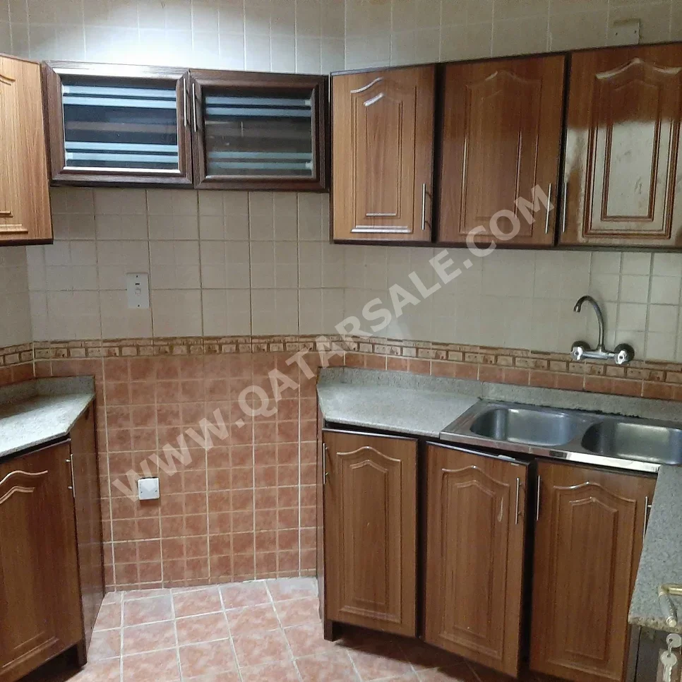 2 Bedrooms  Apartment  For Rent  in Doha -  Al Mansoura  Not Furnished
