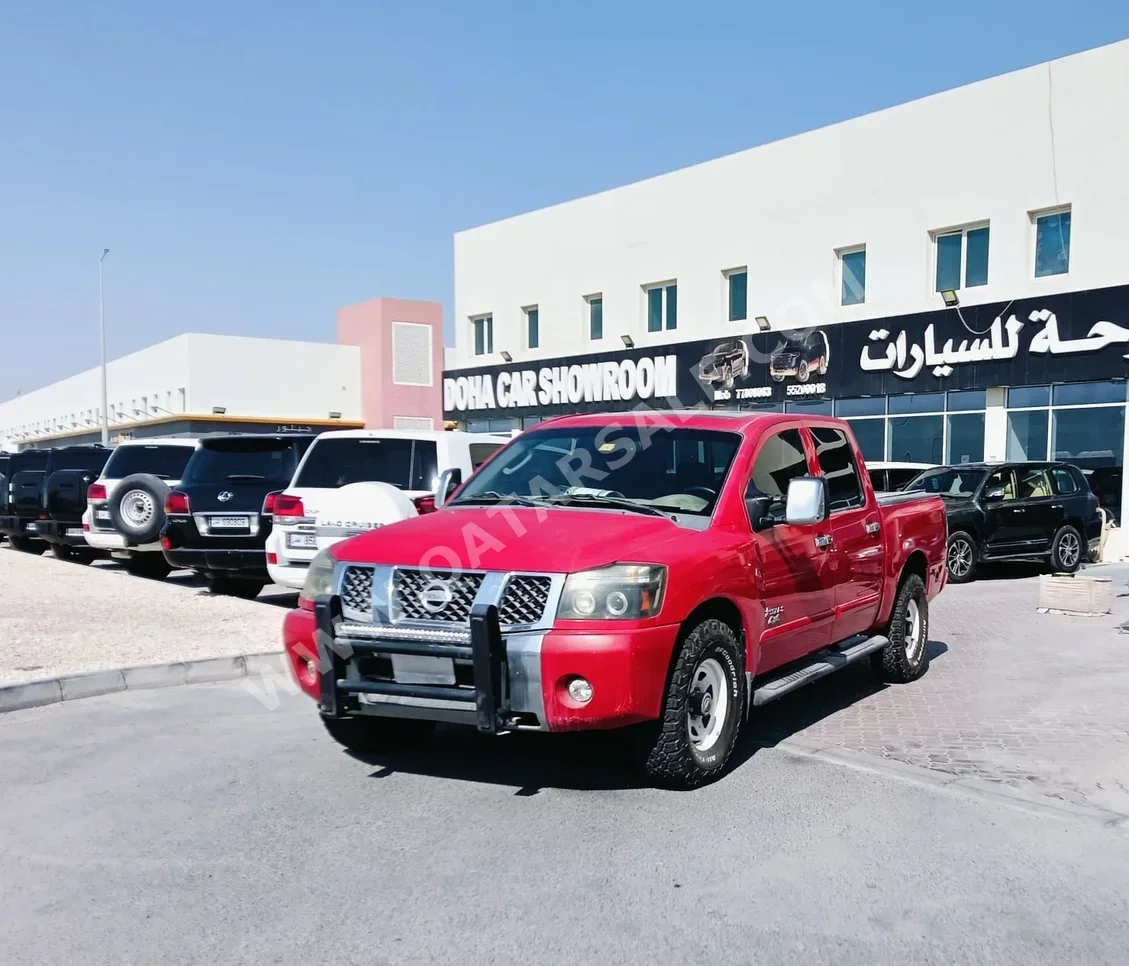 Nissan  Navara  2006  Automatic  207,000 Km  4 Cylinder  Rear Wheel Drive (RWD)  Pick Up  Red