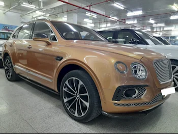 Bentley  Bentayga  2018  Automatic  79,000 Km  12 Cylinder  Four Wheel Drive (4WD)  SUV  Gold