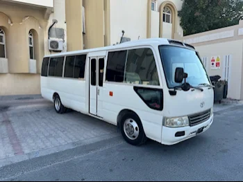 Toyota  Coaster  2015  Manual  400,000 Km  4 Cylinder  Rear Wheel Drive (RWD)  Van / Bus  White and Blue