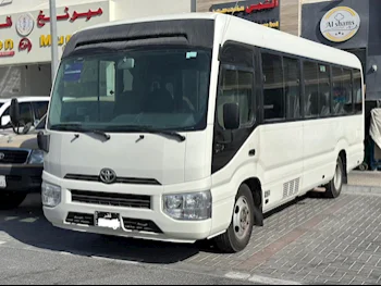 Toyota  Coaster  2019  Manual  168,000 Km  4 Cylinder  Rear Wheel Drive (RWD)  Van / Bus  White