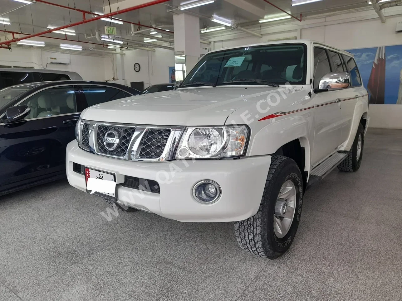 Nissan  Patrol  Safari  2023  Manual  10,000 Km  6 Cylinder  Four Wheel Drive (4WD)  SUV  White  With Warranty