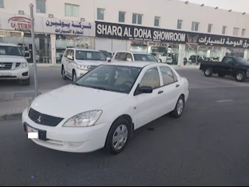 Mitsubishi  Lancer  2014  Manual  230,000 Km  4 Cylinder  Front Wheel Drive (FWD)  Sedan  White