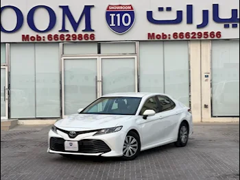 Toyota  Camry  LE  2019  Automatic  53,000 Km  4 Cylinder  Front Wheel Drive (FWD)  Sedan  White