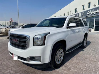 GMC  Yukon  SLE  2016  Automatic  242,000 Km  8 Cylinder  Rear Wheel Drive (RWD)  SUV  White