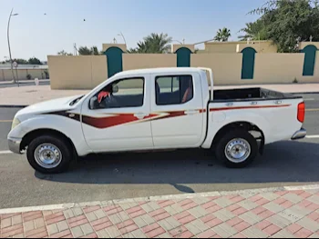 Nissan  Navara  SE  2014  Manual  285,000 Km  4 Cylinder  Rear Wheel Drive (RWD)  Pick Up  White