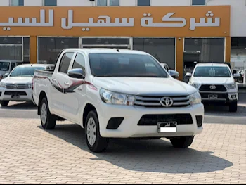 Toyota  Hilux  2023  Manual  59,000 Km  4 Cylinder  Four Wheel Drive (4WD)  Pick Up  White  With Warranty