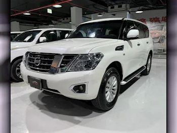 Nissan  Patrol  SE  2014  Automatic  229,000 Km  8 Cylinder  Four Wheel Drive (4WD)  SUV  Pearl