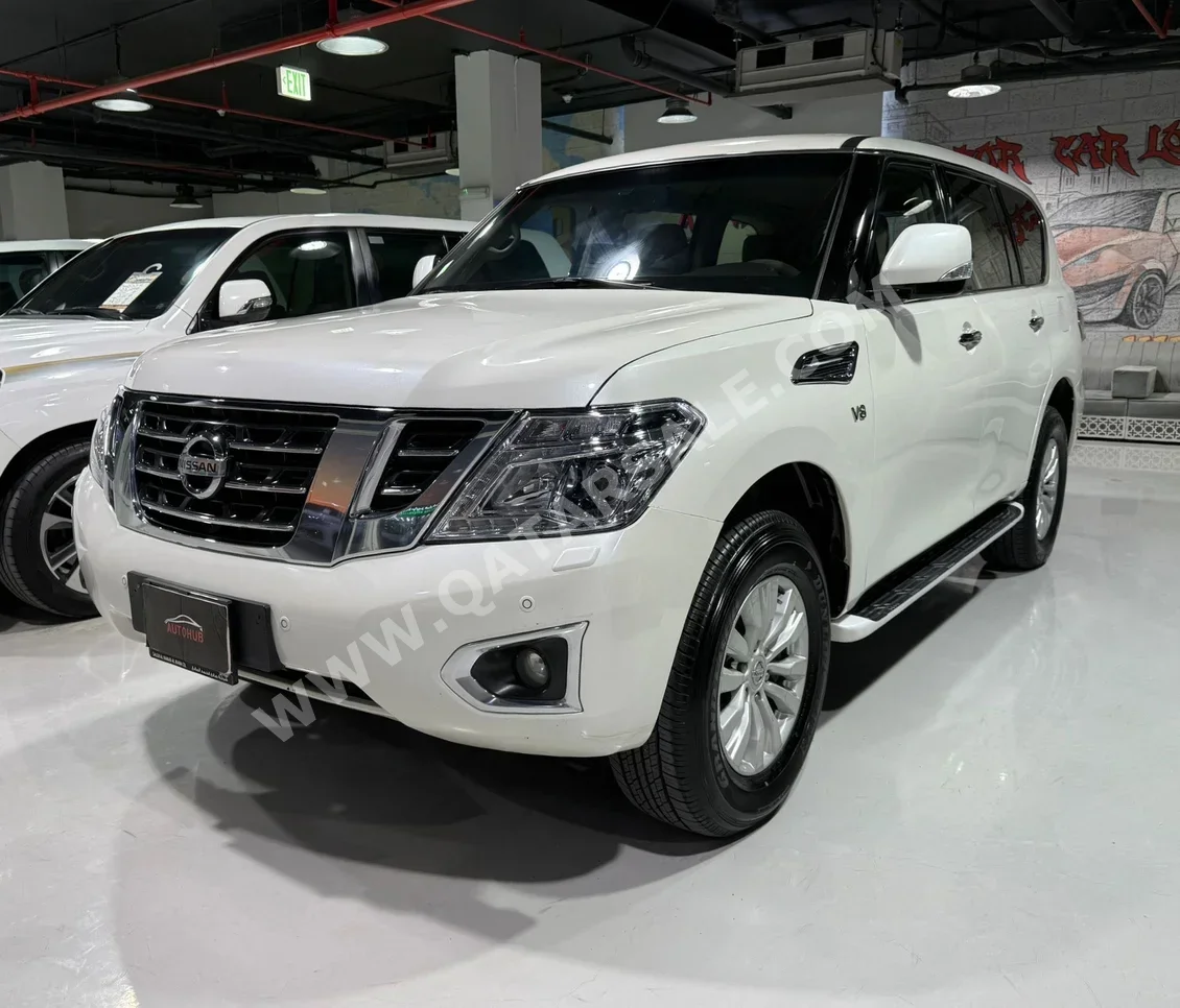 Nissan  Patrol  SE  2014  Automatic  229,000 Km  8 Cylinder  Four Wheel Drive (4WD)  SUV  Pearl