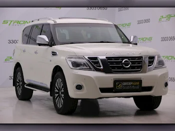 Nissan  Patrol  Platinum  2015  Automatic  140,000 Km  8 Cylinder  Four Wheel Drive (4WD)  SUV  White  With Warranty