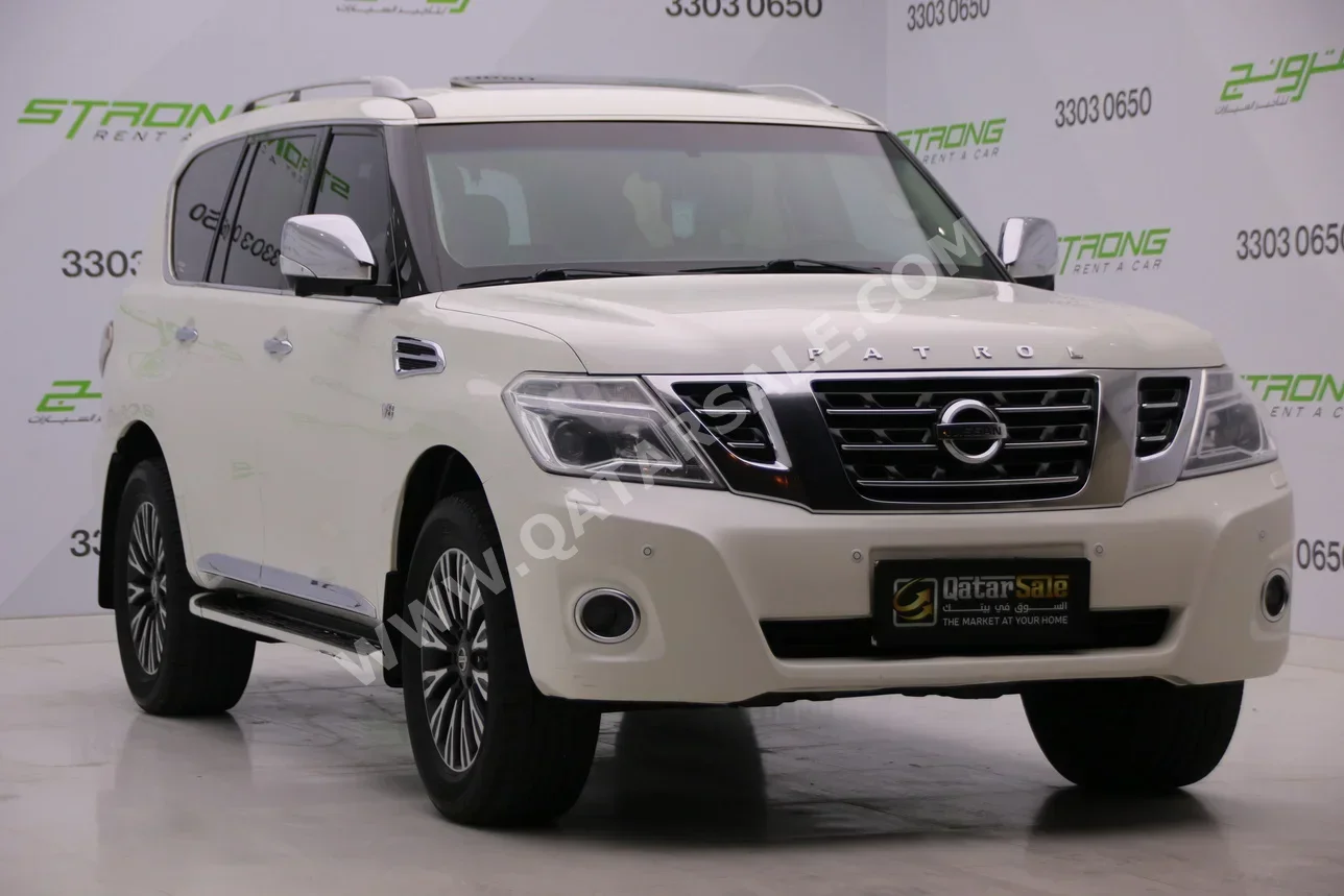 Nissan  Patrol  Platinum  2015  Automatic  140,000 Km  8 Cylinder  Four Wheel Drive (4WD)  SUV  White  With Warranty