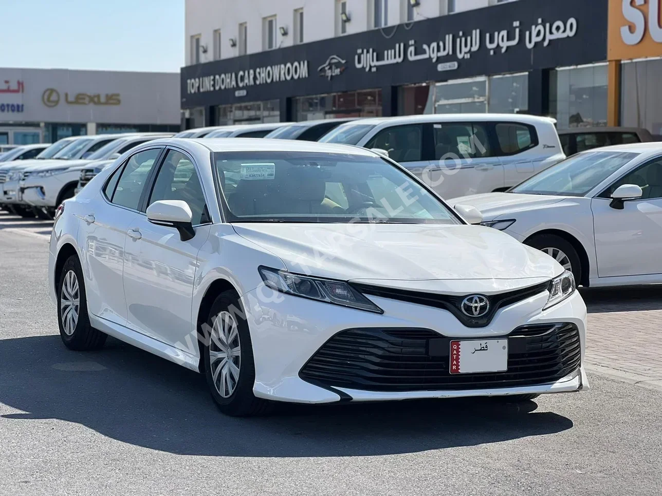 Toyota  Camry  LE  2019  Automatic  31,000 Km  4 Cylinder  Front Wheel Drive (FWD)  Sedan  White