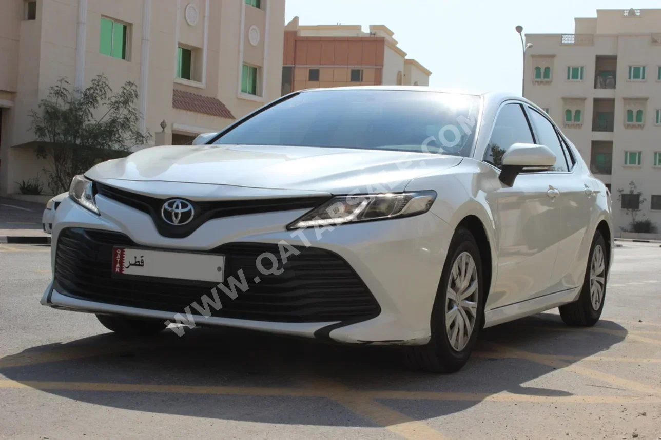 Toyota  Camry  LE  2019  Automatic  150,000 Km  4 Cylinder  Front Wheel Drive (FWD)  Sedan  White