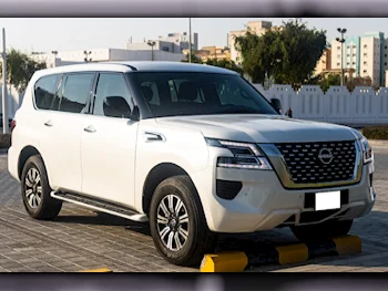 Nissan  Patrol  XE  2023  Automatic  18,222 Km  6 Cylinder  Four Wheel Drive (4WD)  SUV  White  With Warranty