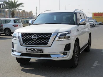 Nissan  Patrol  Platinum  2023  Automatic  11,000 Km  6 Cylinder  Four Wheel Drive (4WD)  SUV  White  With Warranty