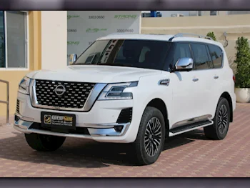 Nissan  Patrol  Platinum  2022  Automatic  50,700 Km  6 Cylinder  Four Wheel Drive (4WD)  SUV  White  With Warranty