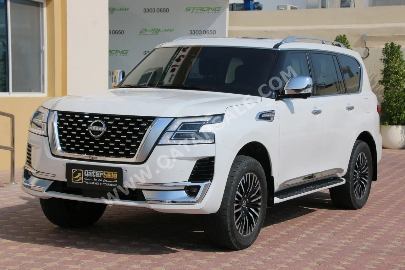 Nissan  Patrol  Platinum  2022  Automatic  50,700 Km  6 Cylinder  Four Wheel Drive (4WD)  SUV  White  With Warranty