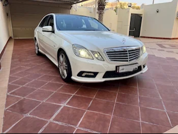 Mercedes-Benz  E-Class  200  2011  Automatic  157,000 Km  4 Cylinder  Rear Wheel Drive (RWD)  Sedan  White