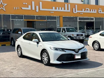 Toyota  Camry  LE  2019  Automatic  64,000 Km  4 Cylinder  Front Wheel Drive (FWD)  Sedan  White