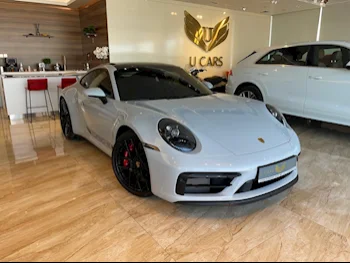 Porsche  911  Carrera GTS  2024  Automatic  4,300 Km  6 Cylinder  Rear Wheel Drive (RWD)  Coupe / Sport  Light Gray  With Warranty