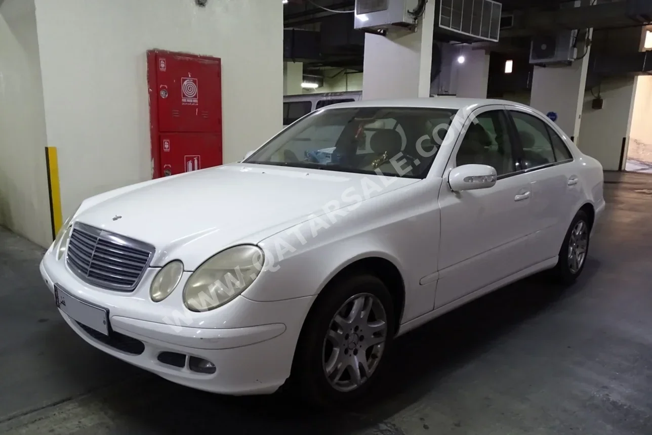 Mercedes-Benz  E-Class  280  2006  Automatic  80,000 Km  4 Cylinder  Rear Wheel Drive (RWD)  Sedan  White