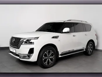 Nissan  Patrol  LE Titanium  2024  Automatic  6,095 Km  8 Cylinder  Four Wheel Drive (4WD)  SUV  White  With Warranty