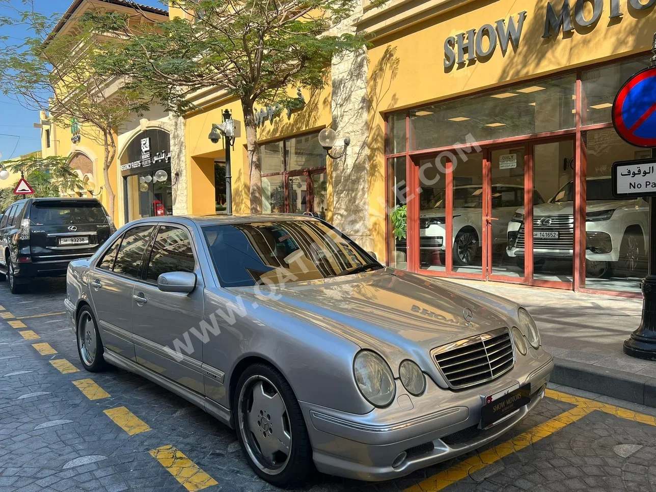 Mercedes-Benz  E-Class  55 AMG  2000  Automatic  169,000 Km  4 Cylinder  Rear Wheel Drive (RWD)  Sedan  Silver