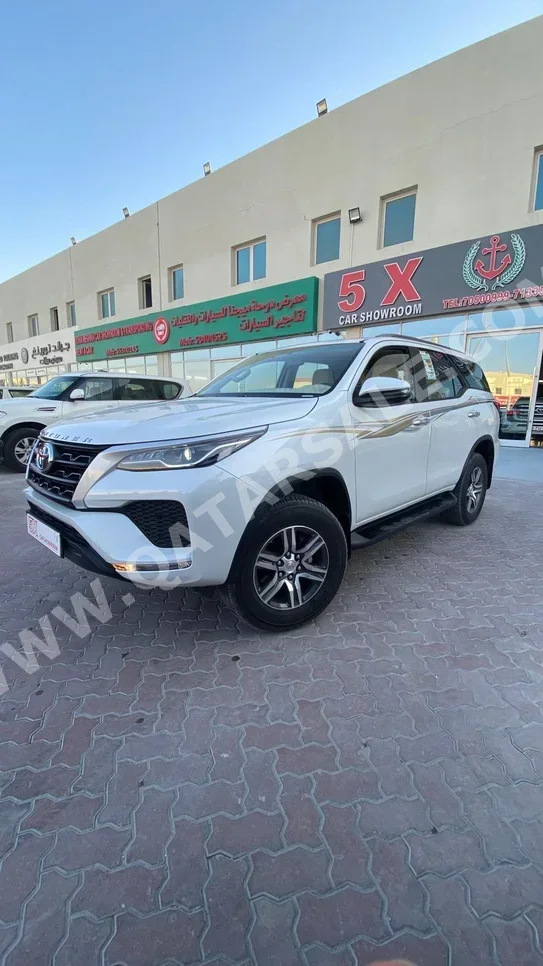 Toyota  Fortuner  2024  Automatic  7,000 Km  4 Cylinder  Four Wheel Drive (4WD)  SUV  White  With Warranty