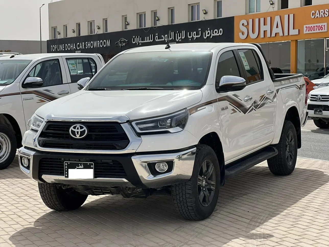 Toyota  Hilux  2024  Automatic  7,000 Km  4 Cylinder  Four Wheel Drive (4WD)  Pick Up  White  With Warranty