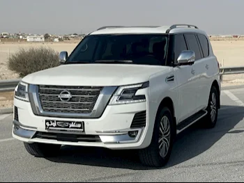 Nissan  Patrol  Platinum  2021  Automatic  22,000 Km  6 Cylinder  Four Wheel Drive (4WD)  SUV  White  With Warranty