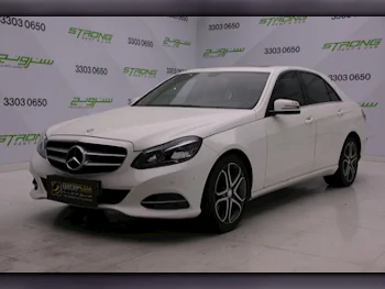 Mercedes-Benz  E-Class  200  2016  Automatic  77,000 Km  4 Cylinder  Rear Wheel Drive (RWD)  Sedan  White