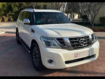 Nissan  Patrol  Platinum  2014  Automatic  203,000 Km  8 Cylinder  Four Wheel Drive (4WD)  SUV  White  With Warranty