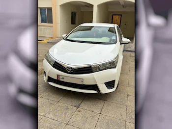 Toyota  Corolla  XLI  2014  Automatic  103,000 Km  4 Cylinder  Front Wheel Drive (FWD)  Sedan  White  With Warranty