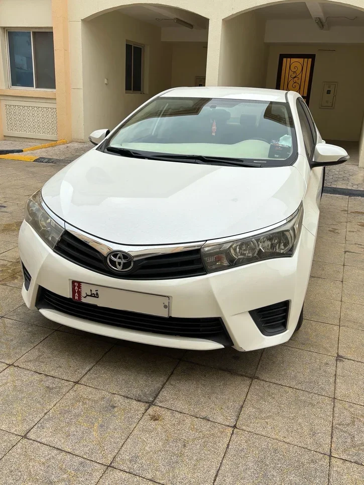 Toyota  Corolla  XLI  2014  Automatic  103,000 Km  4 Cylinder  Front Wheel Drive (FWD)  Sedan  White  With Warranty