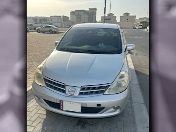 Nissan  Tiida  2010  Automatic  284,465 Km  4 Cylinder  Hatchback  Silver