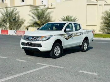 Mitsubishi  L 200  2019  Manual  125,000 Km  4 Cylinder  Rear Wheel Drive (RWD)  Pick Up  White