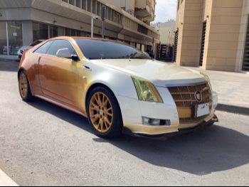 Cadillac  CTS  2011  Automatic  171,000 Km  6 Cylinder  Rear Wheel Drive (RWD)  Coupe / Sport  White and Orange
