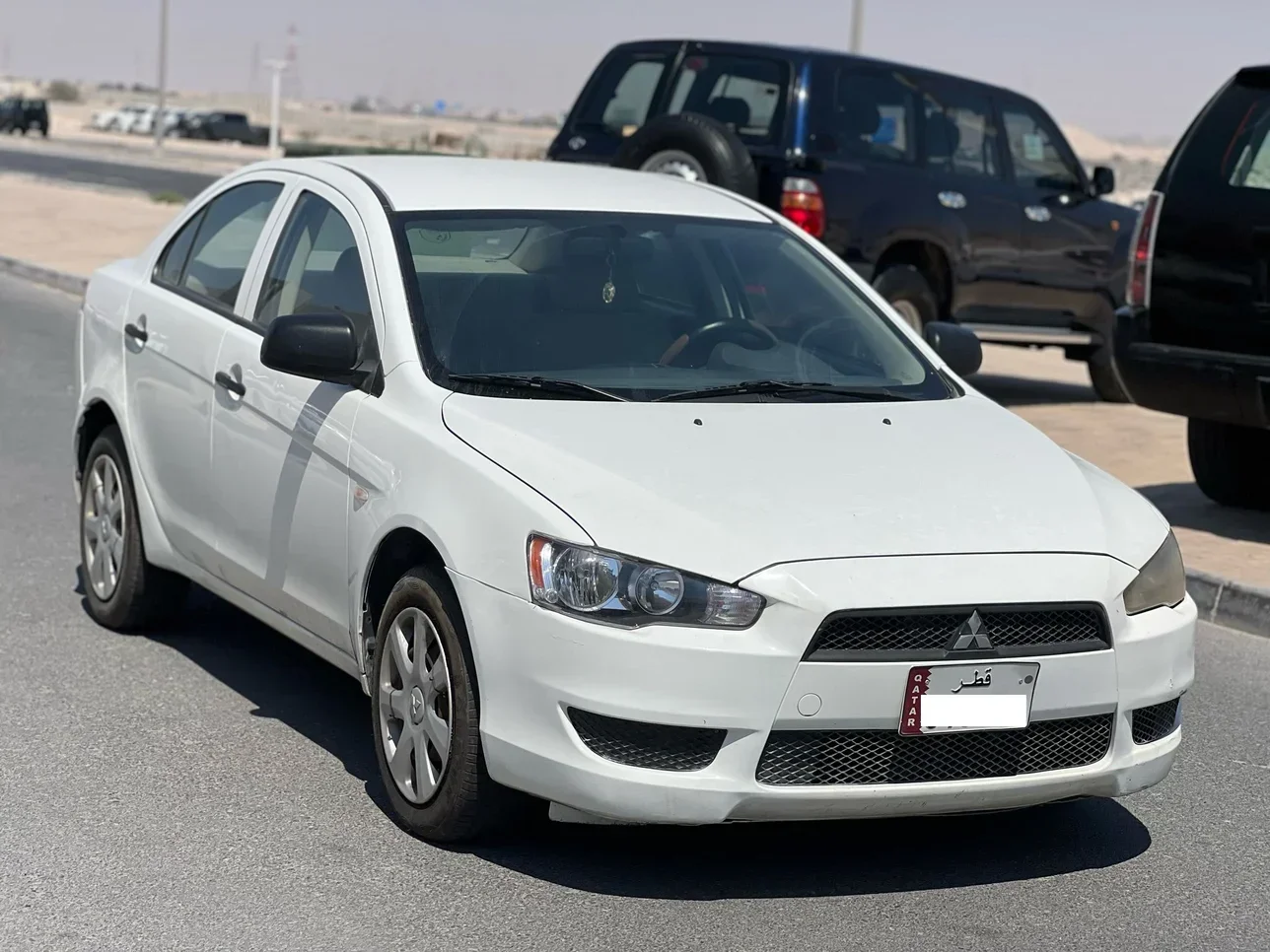 Mitsubishi  Lancer  2014  Automatic  203,000 Km  4 Cylinder  Front Wheel Drive (FWD)  Sedan  White