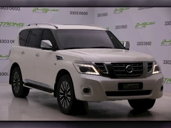 Nissan  Patrol  Platinum  2014  Automatic  242,000 Km  8 Cylinder  Four Wheel Drive (4WD)  SUV  Pearl