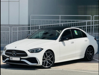 مرسيدس - بنز  سي - كلاس  300 AMG  2022  اوتوماتيك  18,000 كم  4 سلندر  دفع خلفي  سيدان  أبيض  تحت الضمان