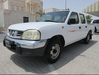 Nissan  Navara  2010  Manual  129,000 Km  4 Cylinder  Rear Wheel Drive (RWD)  Pick Up  White