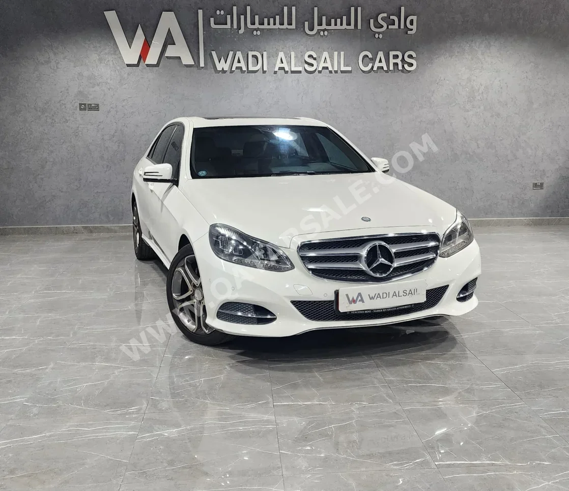 Mercedes-Benz  E-Class  200  2016  Automatic  75,000 Km  4 Cylinder  Rear Wheel Drive (RWD)  Sedan  White