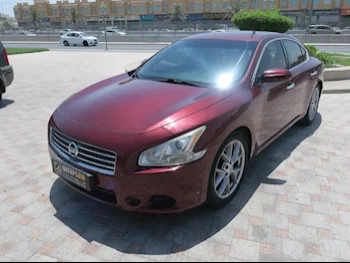 Nissan  Maxima  2010  Automatic  85,000 Km  6 Cylinder  Rear Wheel Drive (RWD)  Sedan  Maroon