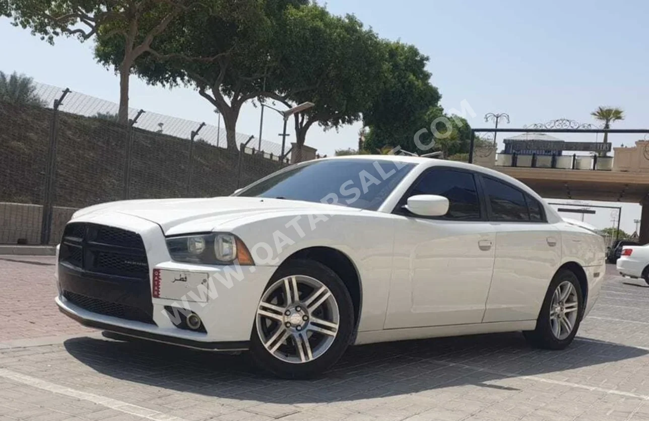 Dodge  Charger  2011  Tiptronic  264,000 Km  6 Cylinder  Rear Wheel Drive (RWD)  Sedan  White