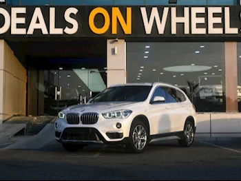 BMW  X-Series  X1  2019  Automatic  85,000 Km  4 Cylinder  Front Wheel Drive (FWD)  SUV  White  With Warranty