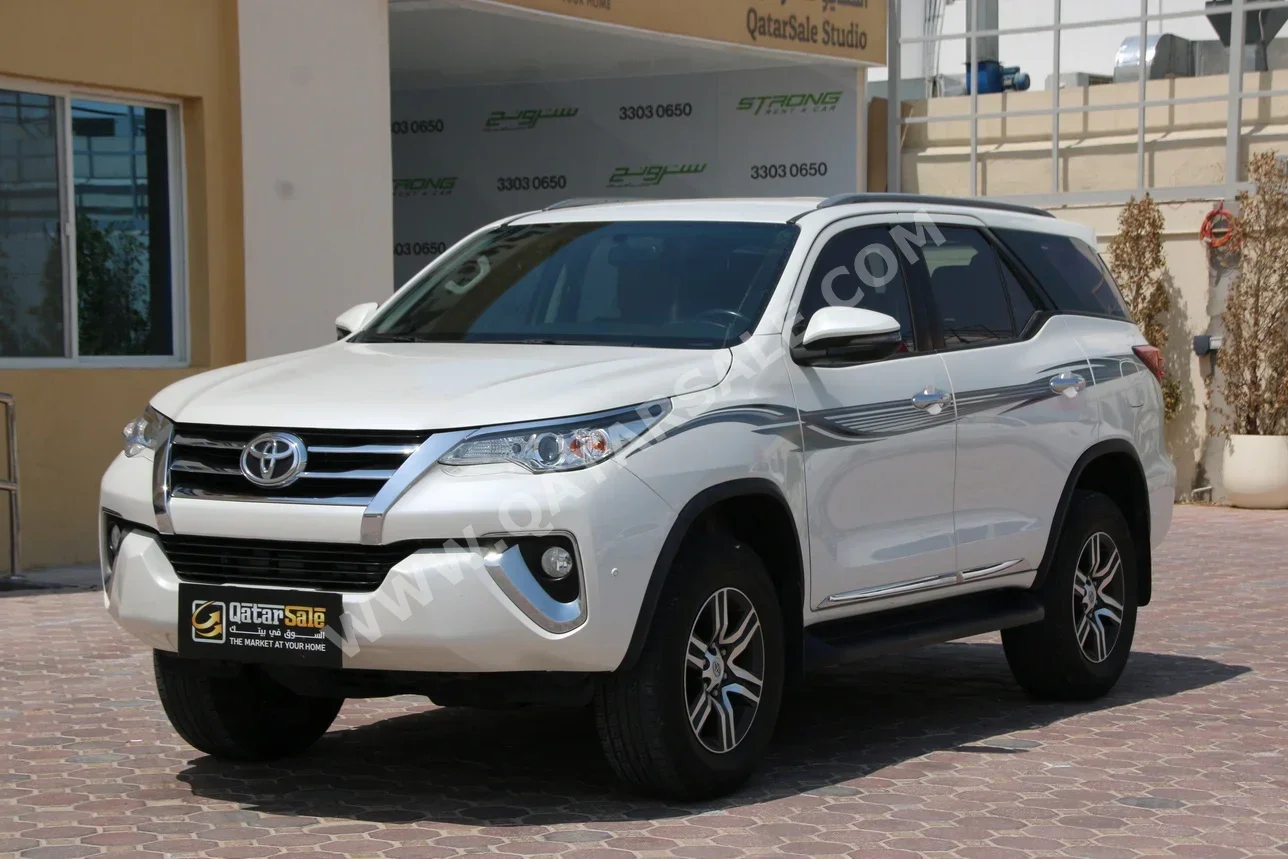  Toyota  Fortuner  2019  Automatic  104,000 Km  6 Cylinder  Four Wheel Drive (4WD)  SUV  Pearl  With Warranty