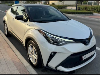 Toyota  C-HR  HIBRID  2023  Automatic  10,600 Km  4 Cylinder  Front Wheel Drive (FWD)  SUV  White  With Warranty