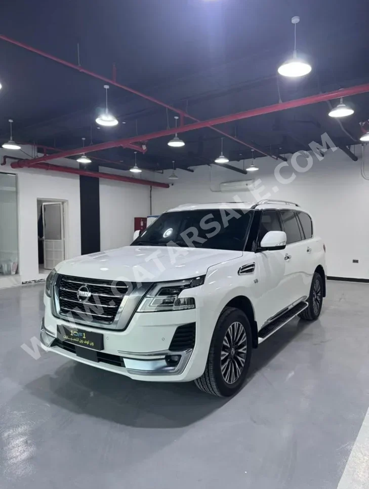 Nissan  Patrol  Titanium  2020  Automatic  123,000 Km  8 Cylinder  Four Wheel Drive (4WD)  SUV  White