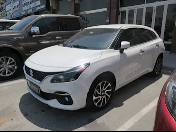 Suzuki  Baleno  2024  Automatic  23,000 Km  4 Cylinder  Front Wheel Drive (FWD)  Sedan  White  With Warranty